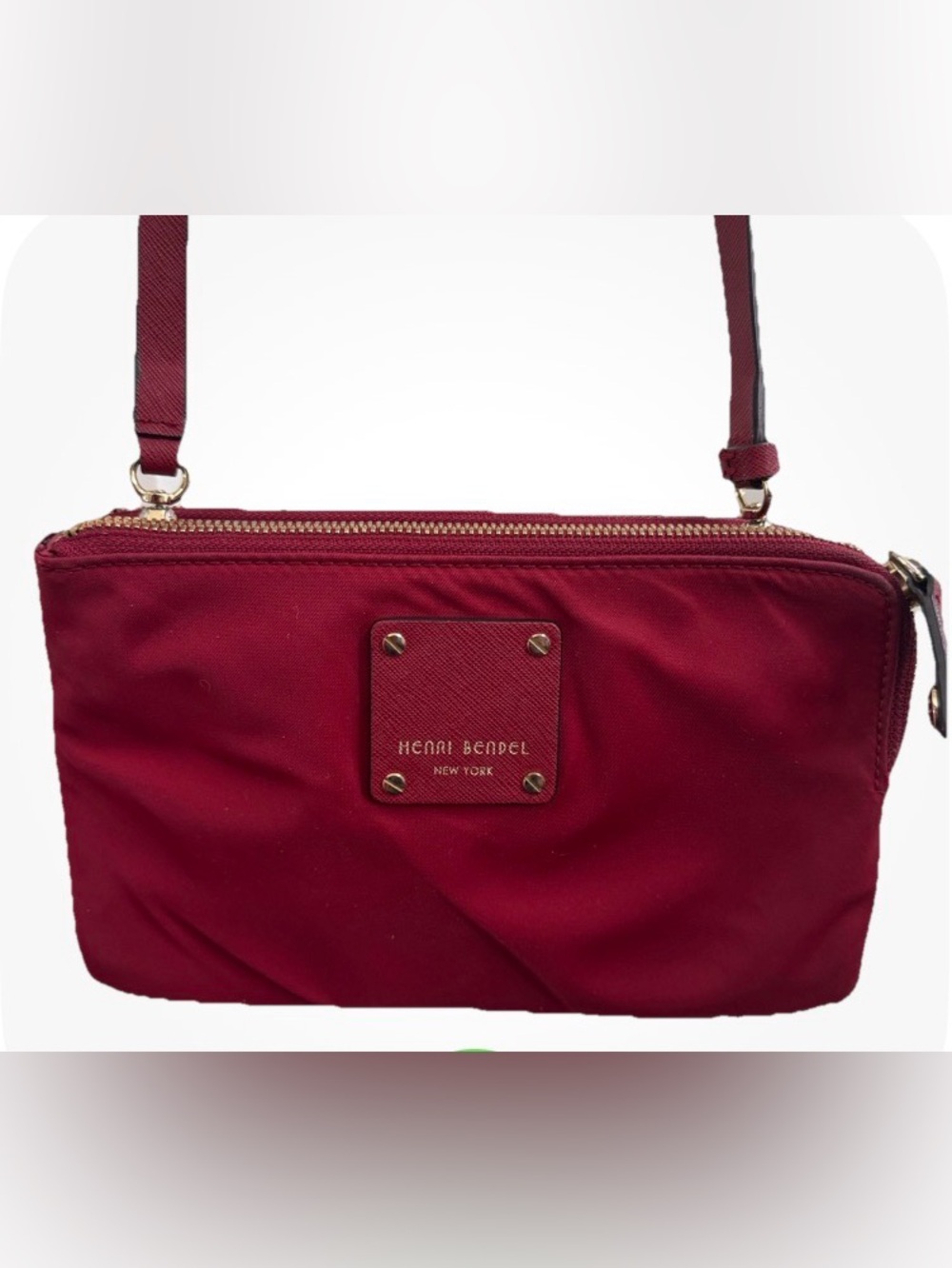 henri bendel burgundy crossbody with gold-tone accents